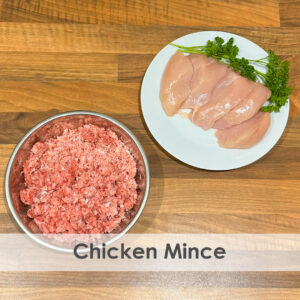 A bowl of raw dog food with chicken