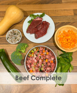 A bowl of raw dog food with beef, courgette, Broccoli, pumpkin, spinach, butternut squash