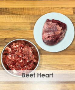 A bowl of raw dog food with beef heart