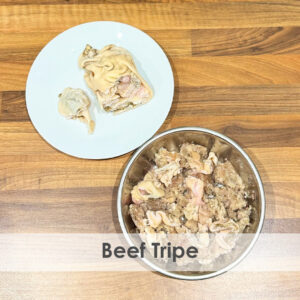 A bowl of raw dog food with beef tripe