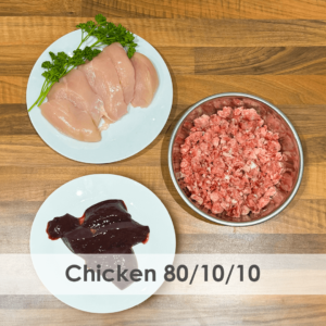 A bowl of raw dog food with chicken, offal and bone