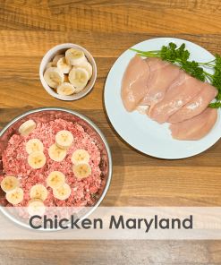A bowl of raw dog food with chicken and banana